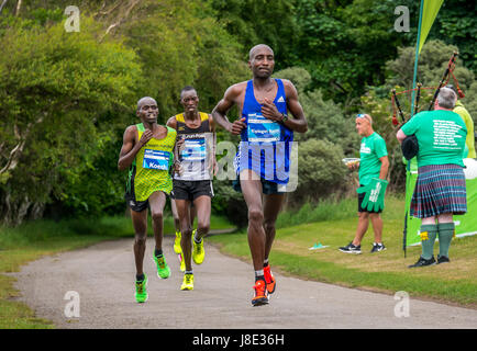 Gosford Estate, East Lothian, Scotland, UK. 28th May, 2017 Top Kenyan male runners Stanley Kiprotich Bett, Julius Kiplagat Korir and Japhet Koech in the Edinburgh Marathon Festival 2017 at Mile 18. Julius, number 127, finished in 1st place, Stanley, number 128, finished 2nd and Japhet, number 123, finished 3rd Stock Photo