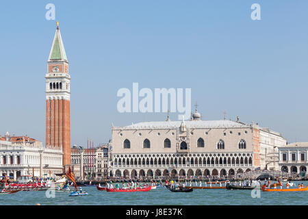 Venice, Veneto, Italy. 28th May, 2017. Participants in the cortege and the Serenissima carrying the dignatories moving into position for the Festa de la Sensa passing in front of the Camapanile and Doges Palace, Venice Veneto, Italy, During the Fete de la Sensa a gold ring is blessed by the Patriach and tossed into the lagoon marrying Venice to the sea. Stock Photo