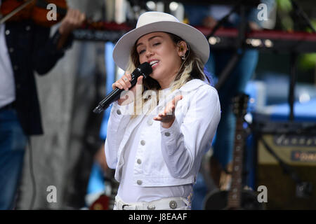 US singer Miley Cyrus performs on stage during NBC's Today show at the Rockefeller Plaza in New York on May 26, 2017. credit: Erik Pendzich Stock Photo