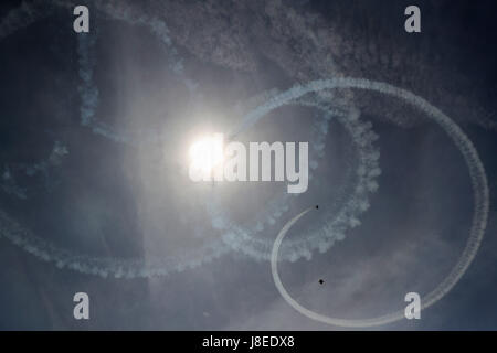 New York, USA. 28th May, 2017. A plane performs aerobatics during the 14th annual Bethpage Air Show over Johns Beach in New York, the United States, May 28, 2017. Credit: Wang Ying/Xinhua/Alamy Live News Stock Photo