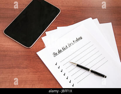 blank checklist on wooden table Stock Photo