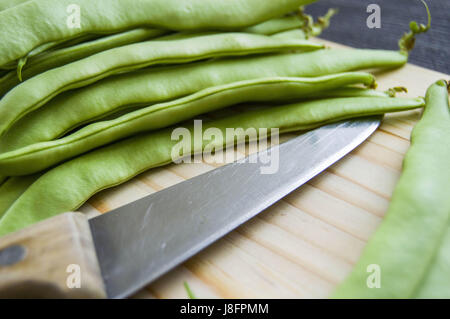 Fresh green beans ready to eat, green bean with knife, Stock Photo