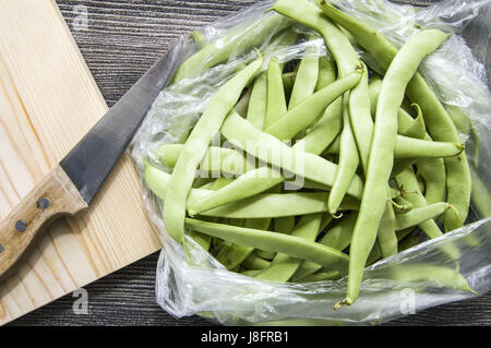 Fresh green beans ready to eat, green bean with knife, Stock Photo