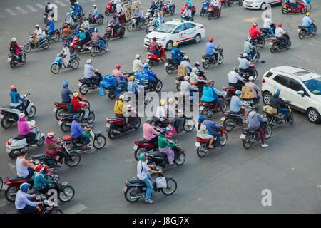 Ho Chi Minh City, Vietnam - November 24, 2015: Motorbike drivers are chaotically moving on the road on November 24, 2015 in Ho Chi Minh City, Vietnam. Stock Photo