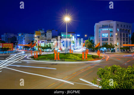 Nha Trang, Vietnam - December 23, 2015: Dusk view of the traffic circle in the center of Nha Trang city on December 23, 2015, Nha Trang, Vietnam. Stock Photo