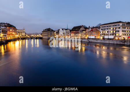 Illuminated Cityhall and Limmat River Bank in the Evening, Zurich, Switzerland Stock Photo