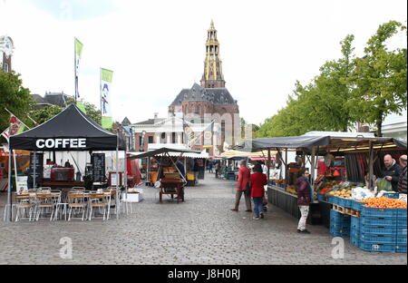 Market day on the large medieval Vismarkt square, city of Groningen, The Netherlands. In background Korenbeurs & Der Aa Kerk (Aa church) Stock Photo