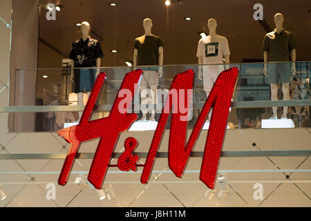 General view of the H&M clothing store sign logo in Cardiff, Wales, UK. Stock Photo