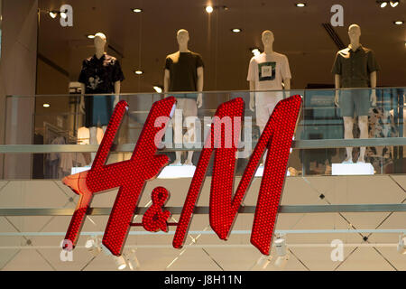 General view of the H&M clothing store sign logo in Cardiff, Wales, UK. Stock Photo