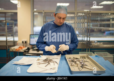 Surgical instruments being cleaned and sterilised at a hospital by a surgical instrument sterilising company Stock Photo