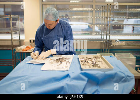 Surgical instruments being cleaned and sterilised at a hospital by a surgical instrument sterilising company Stock Photo