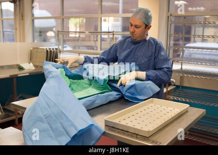 Surgical instruments being cleaned and sterilised at a hospital by a surgical instrument sterilising company Stock Photo