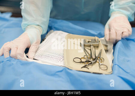 Surgical instruments being cleaned and sterilised at a hospital by a surgical instrument sterilising company Stock Photo