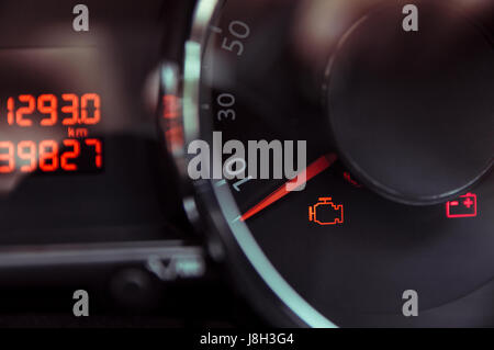 Check engine light. Car dashboard in closeup Stock Photo - Alamy