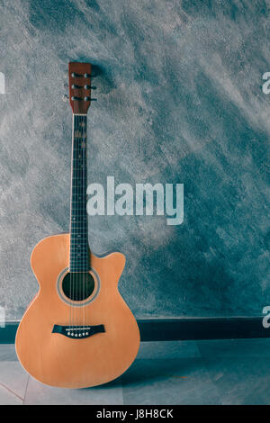Acoustic guitar on the floor. Stock Photo