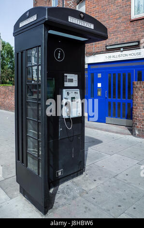 A New World Telecom Phone box, with a stylistic reference to the traditional British Phone Box, in East London Stock Photo
