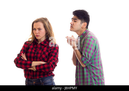 Young couple in plaid shirts arguing  Stock Photo