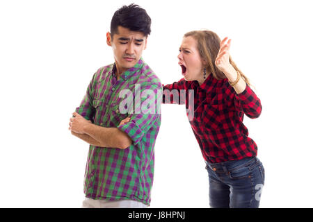 Young couple in plaid shirts arguing  Stock Photo