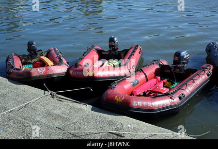 KAOHSIUNG, TAIWAN -- MAY 21, 2017: The fire department prepares rubber dinghys as a safety measure for the Dragon Boat Festival. Stock Photo