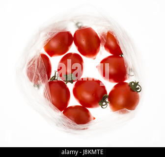 Small red tomatoes in the package Stock Photo