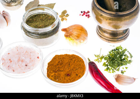Ground dried herb spices and spices in glass jar Stock Photo