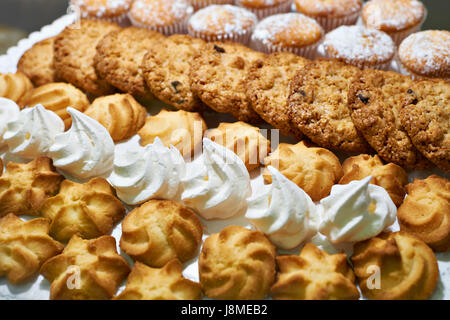 Cookies and meringues on a plate Stock Photo