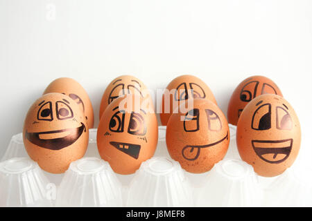 Cheerful eggs in two rows. The concept of the tribune of the fans. Photo for design. Eggs with painted face. Horizontal orientation of the sheet. Stock Photo