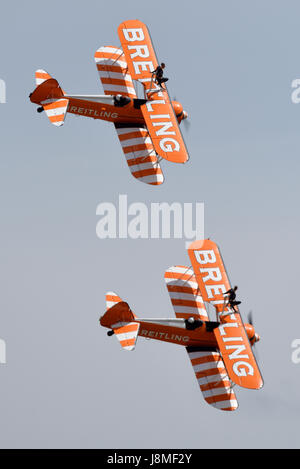 Breitling Wingwalkers displaying at an air show with girls on the top wing Stock Photo