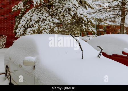 cars covered with snow in the winter blizzard car covered with snow Stock Photo