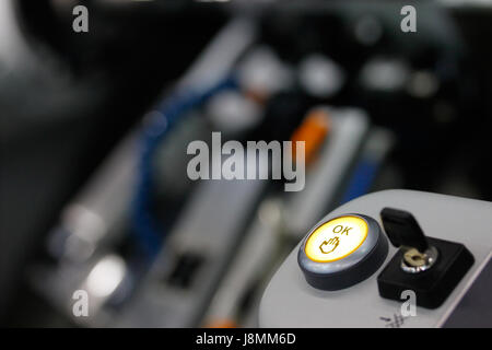 OK push button and key switch on the control panel of of industrial equipment. Selective focus. Stock Photo