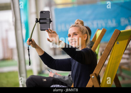 Hay Festival, Wales UK, Monday 29 May 2017 A young woman takes a selfie at the 2017 Hay Literature festival Now in its 30th year, the festival draws tens of thousand of visitors a day to what was described by former US president Bill Clinton as 'the woodstock of the mind' Photo credit Credit: keith morris/Alamy Live News Stock Photo