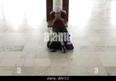 May 29, 2017 - Kuala Lumpur, Kuala Lumpur, Malaysia - A Muslim man offers the evening prayer on the third day of Ramadan. (Credit Image: © Kepy via ZUMA Wire) Stock Photo