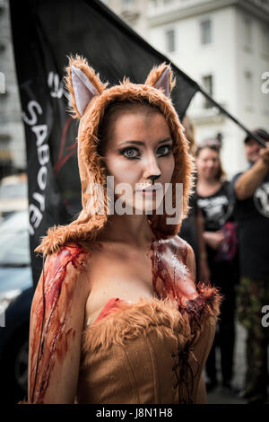 London, UK. 29th May, 2017. Anti-Fox-Hunting march, 29th May 2017, London - A woman is dressed up as an abused fox. Credit: Anja Riedmann/Alamy Live News