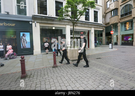 Manchester, UK. 29th May, 2017. Armed police walk through St Anns Square, Manchester, 29th May, 2017 Credit: Barbara Cook/Alamy Live News Stock Photo