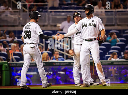 Miami, Florida, USA. 28th May, 2017. Miami Marlins shortstop JT Riddle (39), left, greets Miami Marlins right fielder Giancarlo Stanton (27), right, as he scores a run during the eighth inning of a MLB game between the Los Angeles Angels and the Miami Marlins at the Marlins Park, in Miami, Florida. The Marlins won 9-2. Mario Houben/CSM/Alamy Live News Stock Photo