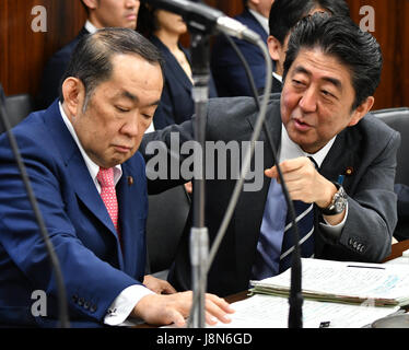 Tokyo, Japan. 30th May, 3017. Japan's Prime Minister Shinzo Abe, right, exchanges words with Justice Minister Katsutoshi Kaneda before the start of a session of the Upper House Justice Committee in the Diet in Tokyo on Tuesday, May 30, 2017. The lower chamber approved a bill allowing authorities to punish those found guilty of planning serious crimes, legislation that opponents say could be used to undermine basic civil liberties, but the proposed legislation, called the 'conspiracy bill,' still requires upper house approval. Credit: Natsuki Sakai/AFLO/Alamy Live News Stock Photo