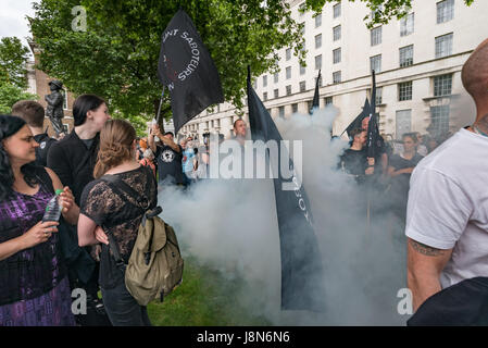 May 29, 2017 - London, UK - London, UK. 29th May 2017. Although the protest organisers had asked for there to be no flares at the even, hunt sabs S set one off in the middle of the crowd of several thousand people at Downing St.The protest toldl Theresa May that the public are against having a vote in Parliament on the fox hunting bill. Polls show that over 80% of the public in city and rural areas are against lifting the ban and many would support stronger measures and proper enforcement of the 2004 ban. Among those who spoke and marched was Prof Andrew King of the Animal Welfare Party who is Stock Photo