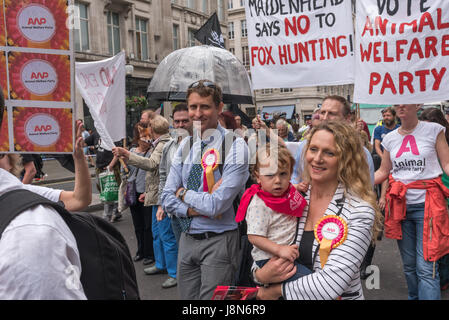London, UK. 29th May, 2017. London, UK. 29th May 2017. Animal Welfare Party candidates Professor Andrew Knight (Maidenhead) and Party Leader Vanessa Hudson (Hackney South and Shoreditch) on the march through London from a rally in Cavendish Square to another at Downing St to tell Theresa May that the public are against having a vote in Parliament on the fox hunting bill. Knight is standing against May in Maidenhead, and the party have a total of four candidates. Polls show that over 80% of the public in city and rural areas are against lifting the ban and many would support stronger measures