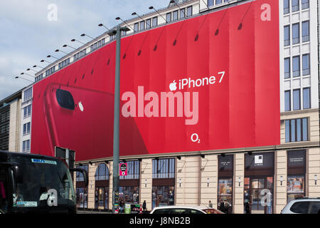 BERLIN, 24TH APRIL:IPhone 7 and O2 huge bill board advertising panel mounted in a building under construction in Potsdamer Platz in in Berlin on April Stock Photo