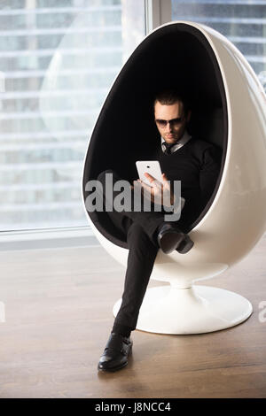 Stylish young man shopping online with tablet Stock Photo