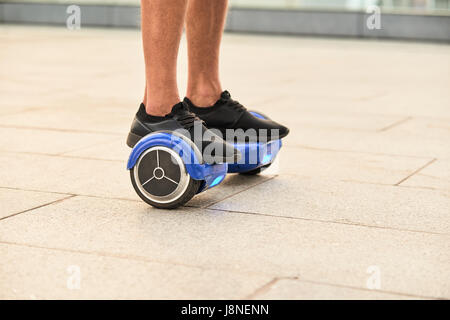 Legs on hoverboard. Stock Photo