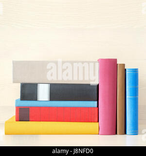 stack of books in the bookself Stock Photo