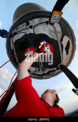 Inflating hot air balloon: Detail of fire burners Stock Photo