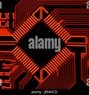 The silhouette of the electrical board with a microprocessor is illuminated by red light. Stock Photo