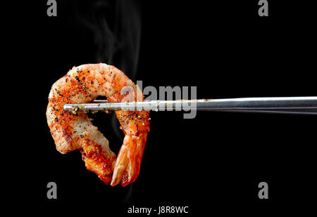 Grill Shrimp BBQ style mixed spicy ,ingredient set in black backgrount with smoke in studio lighting. Stock Photo