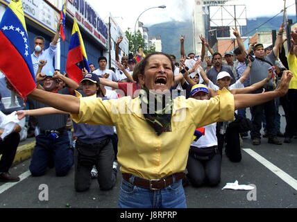 Venezuelans protest against President Hugo Chavez, in Caracas November 18, 2002. Troops clashed with anti-government demonstrators in a new escalation Stock Photo