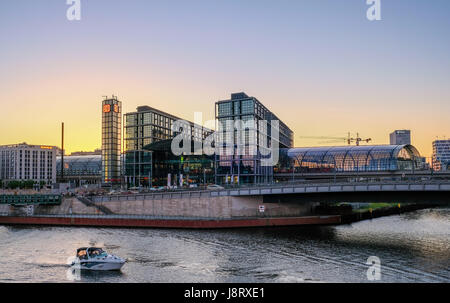 Berlin, Germany - may 27, 2017: Berlin Hauptbahnhof ( Berlin Main Station), river spree with boat with sunset sky background Stock Photo