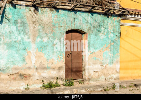 Peeling paint on old, crumbling house wall in Guatemala, Central America Stock Photo