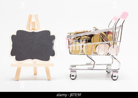 Pictures of coins of different value. baht coins in your shopping cart and blackboard.On white background. Stock Photo