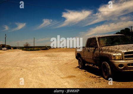 Mud covered truck on dirt road, South Dakota, USA Stock Photo